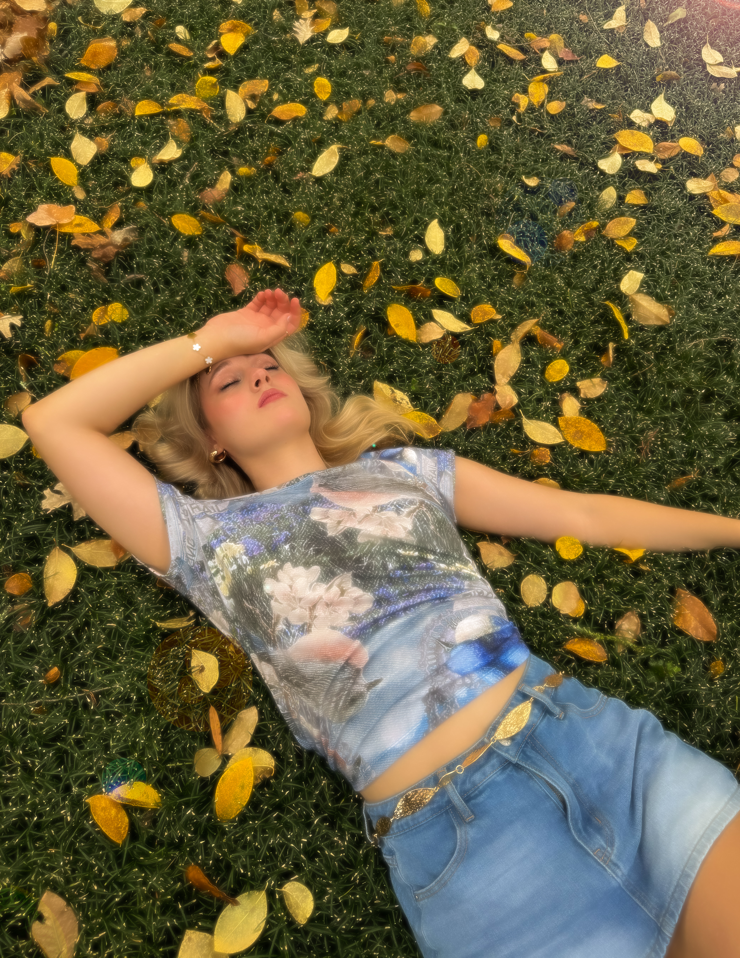 Shot 2 — model lying in the grass wearing the Levi's shirt, daydreaming