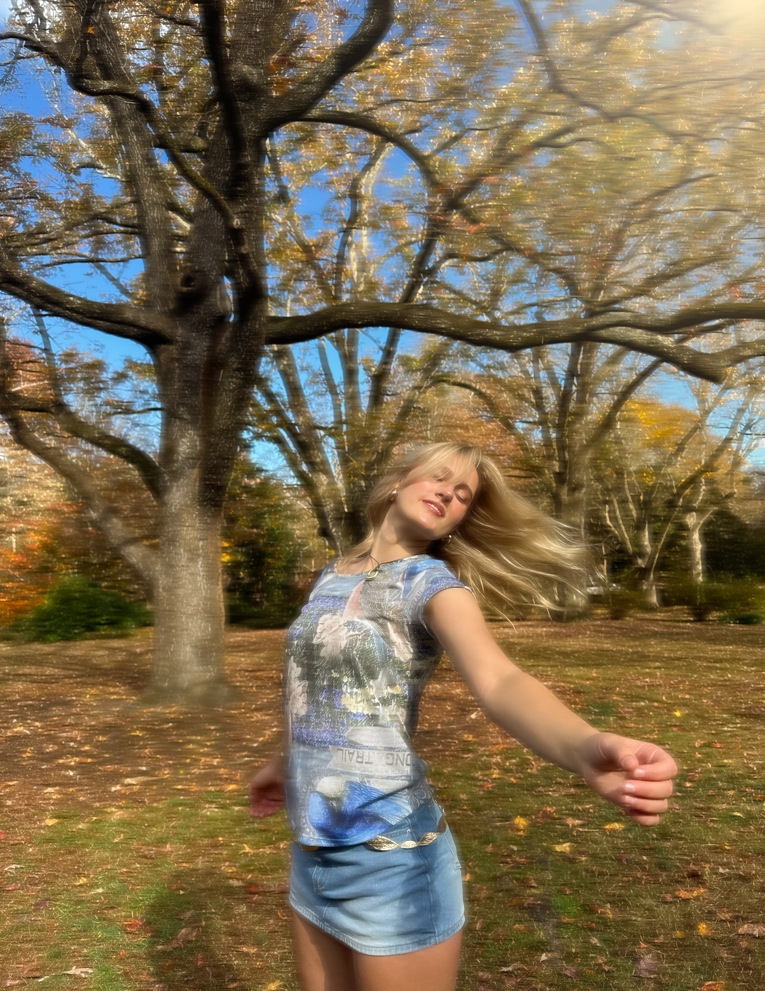 Shot 3 — blurred motion shot of model spinning freely in the arboretum